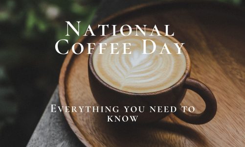 Coffee cup on tray with national coffee day on top