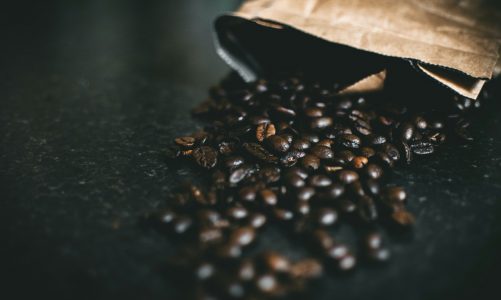 Dark black coffee beans out of bag