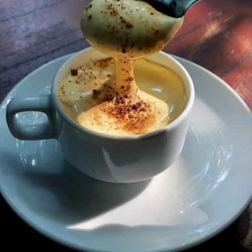white espresso mug with egg coffee inside